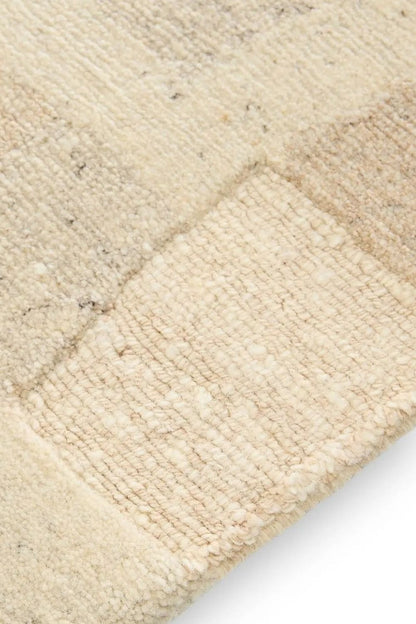 Beigefarbener handgeknüpfter Wollteppich