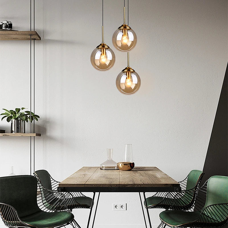 Orbelle Art-déco-Pendelleuchte aus Messing mit Glaskugel