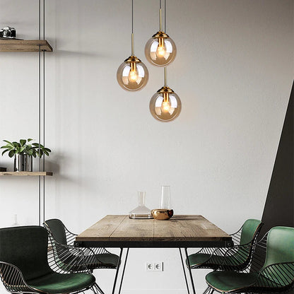 Orbelle Art-déco-Pendelleuchte aus Messing mit Glaskugel