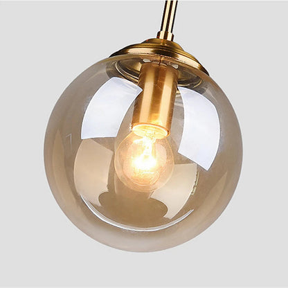 Orbelle Art-déco-Pendelleuchte aus Messing mit Glaskugel