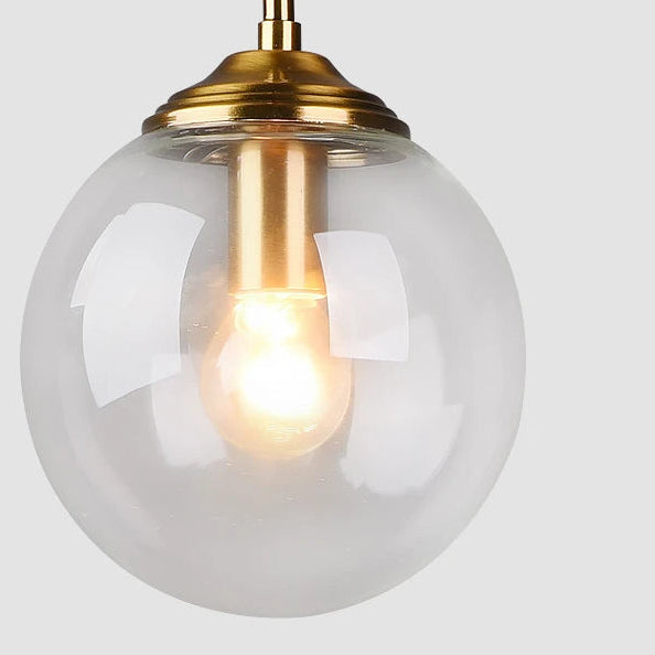 Orbelle Art-déco-Pendelleuchte aus Messing mit Glaskugel